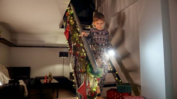 DIY festive staircase garland setup with lights and greenery for holidays
